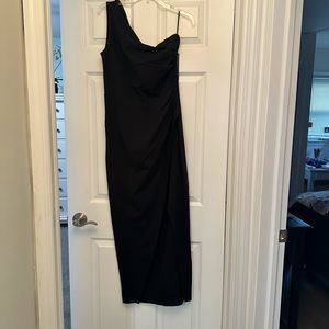 One shoulder black gown with a slit